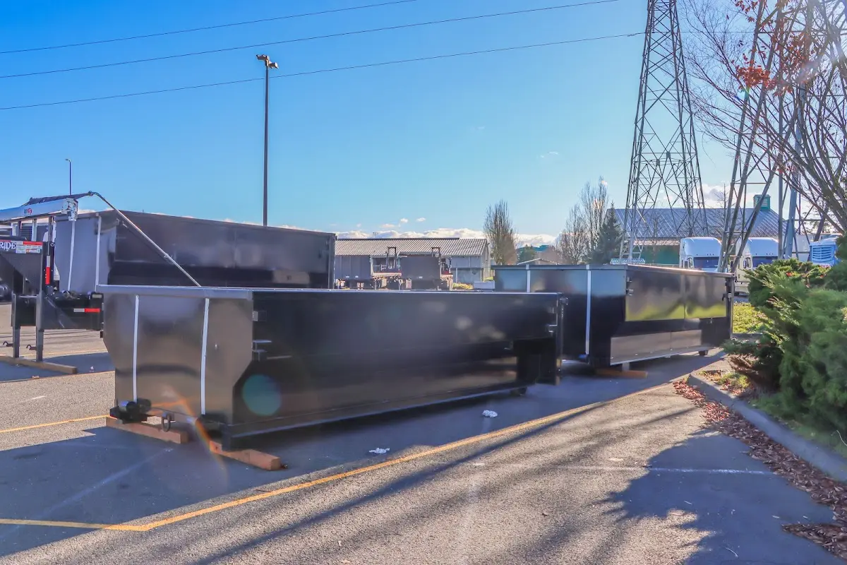 Roll-off dumpster ready for waste disposal at job site for Concrete Dumpster Rental in Amherst